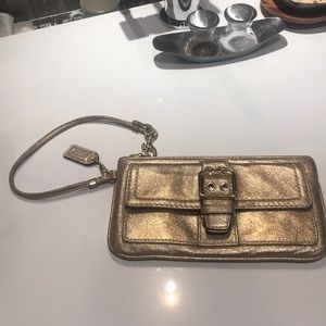 Gold metallic Coach Wristlet
